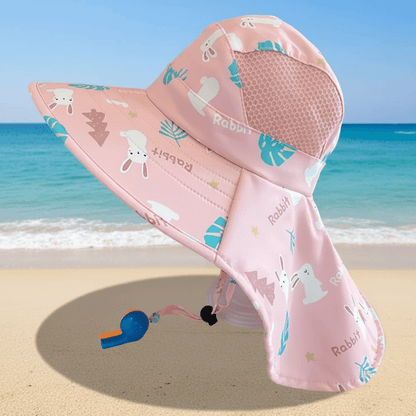 Chapeau rose - fond plage